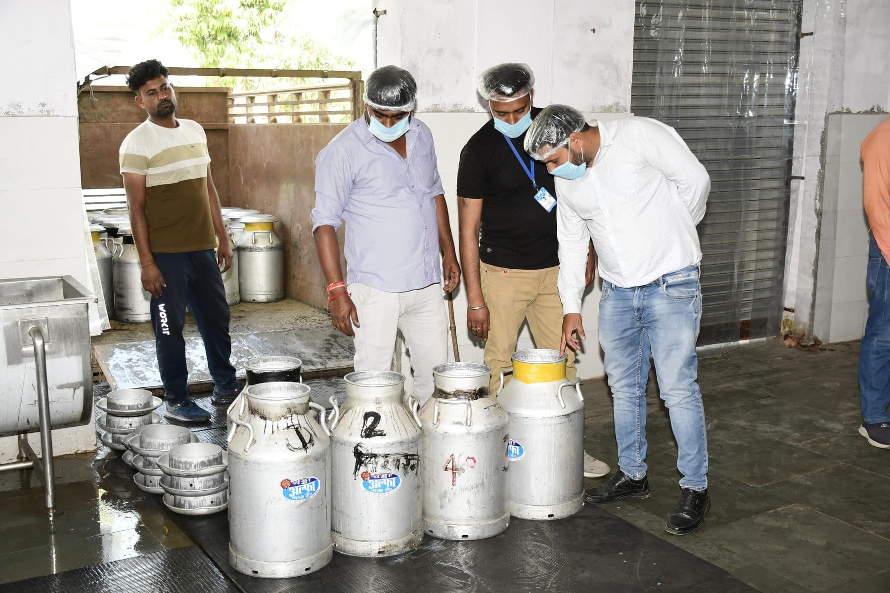 Cans being inspected before unloading